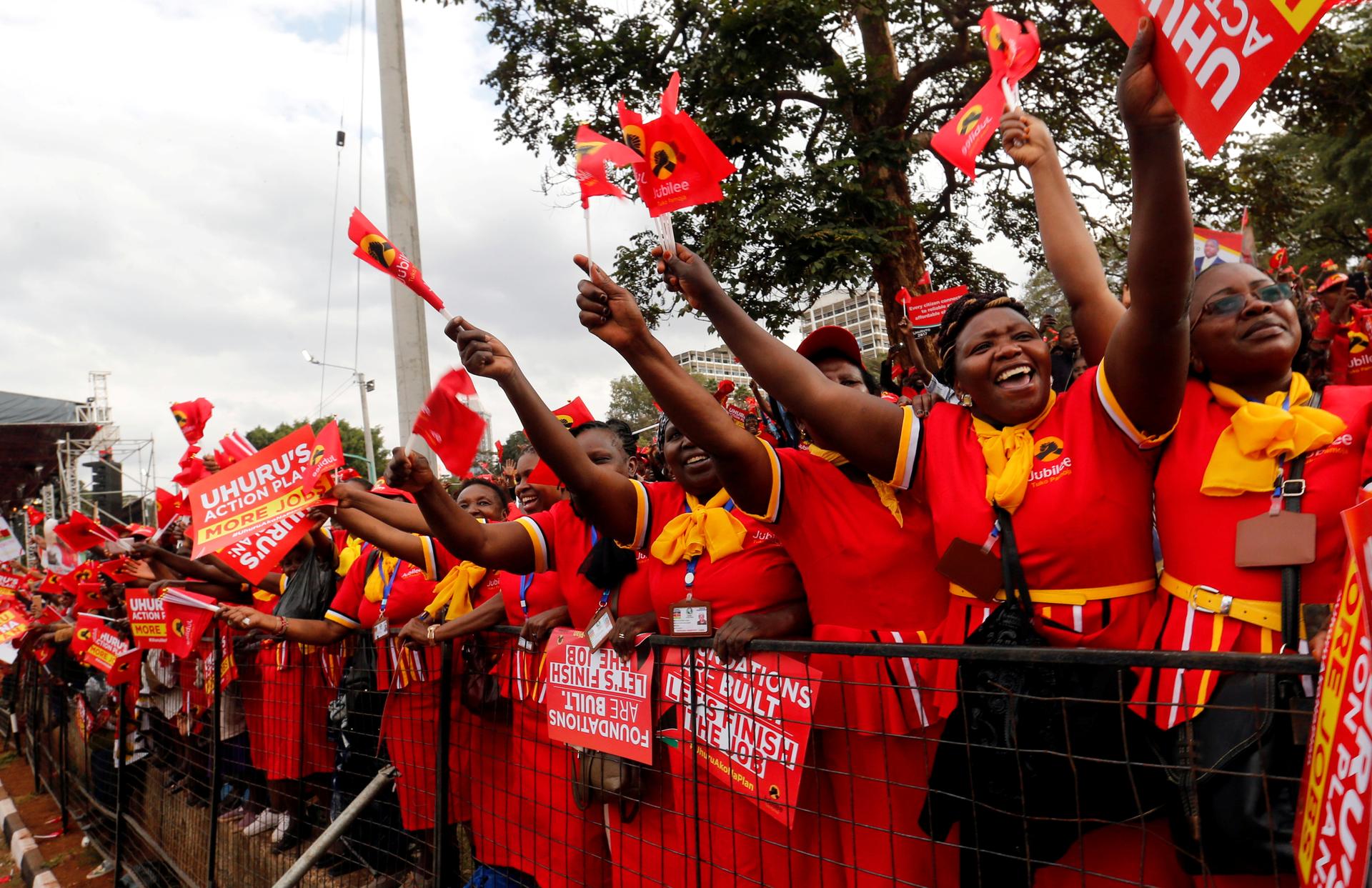 Supporters of Kenya's President Uhuru Kenyatta cheer during a Jubilee Party campaign rally at Uhuru park in Nairobi, Kenya August 4, 2017. 