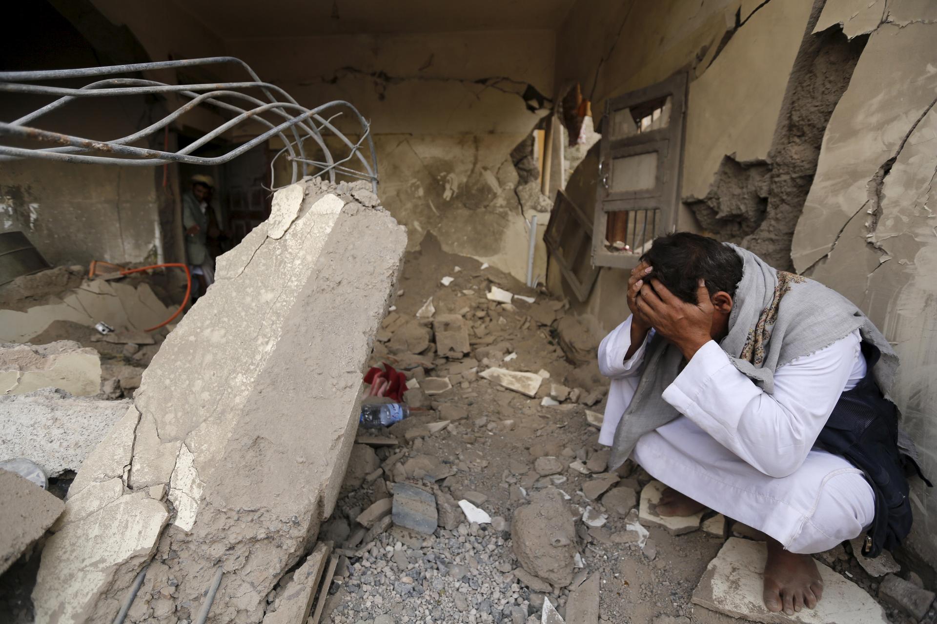 A man who lost his relatives in a Saudi-led air strike cries at the site of the air strike in Yemen's capital Sanaa September 21, 2015.