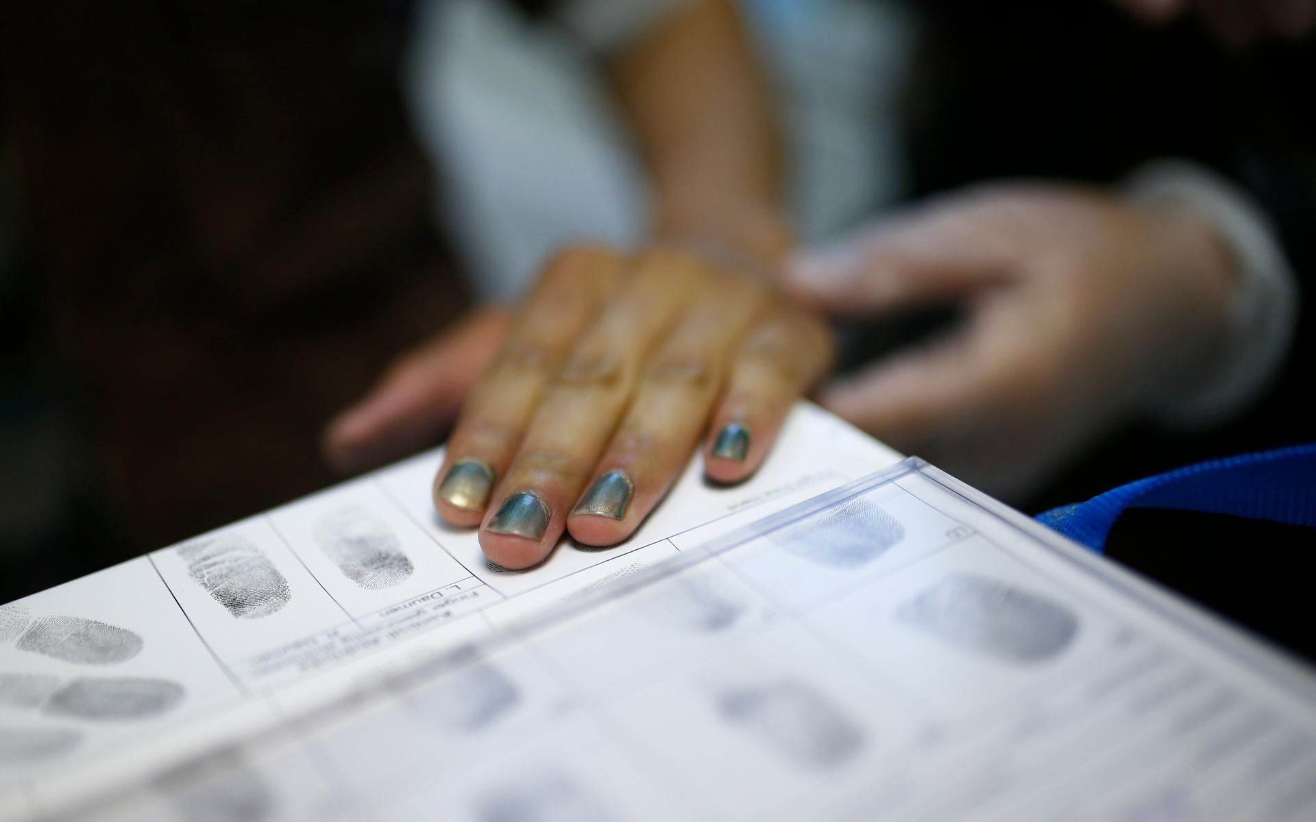 Fingerprints of a migrant are taken during registration at the Patrick-Henry Village refugee center, a former U.S. military facility in Heidelberg, Germany September 29, 2015.