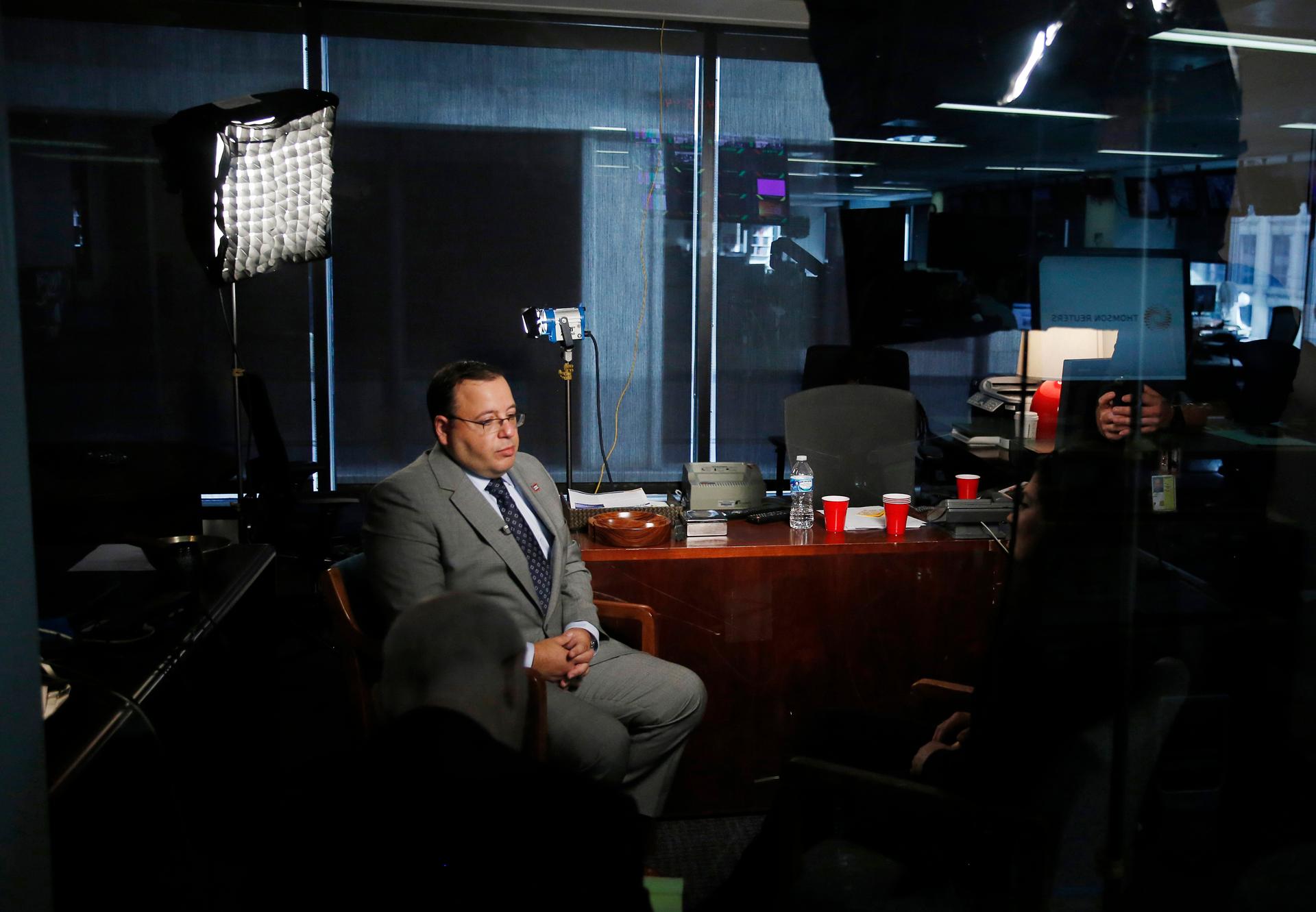 Ali Rezaian, brother of imprisoned Washington Post journalist Jason Rezaian, pauses as he talks about the recent announcement of a verdict in his brother's case by Iran's judiciary during a television interview with Reuters in Washington October 13, 2015.