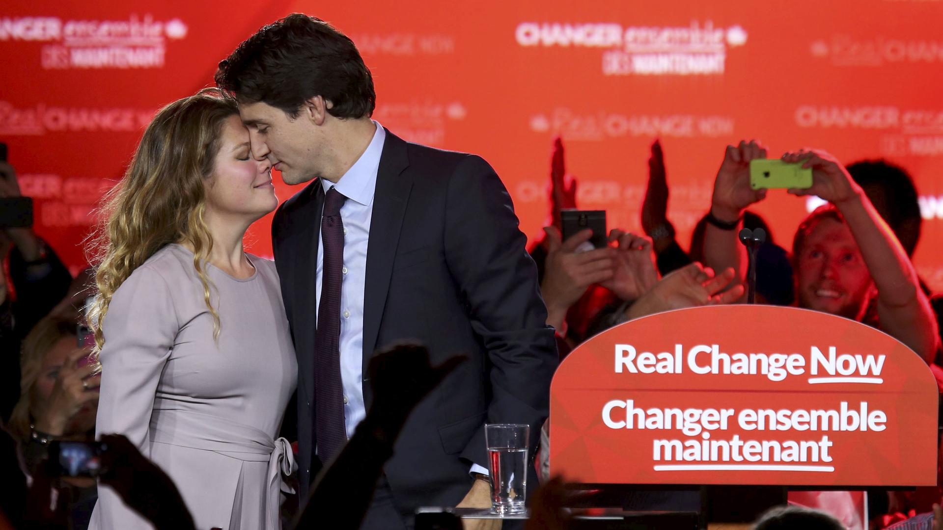 Liberal Party leader Justin Trudeau shares a moment with his wife Sophie Gregoire on a stage in Montreal, after he became the first child of a Canadian Prime Minister to also become Prime Minister