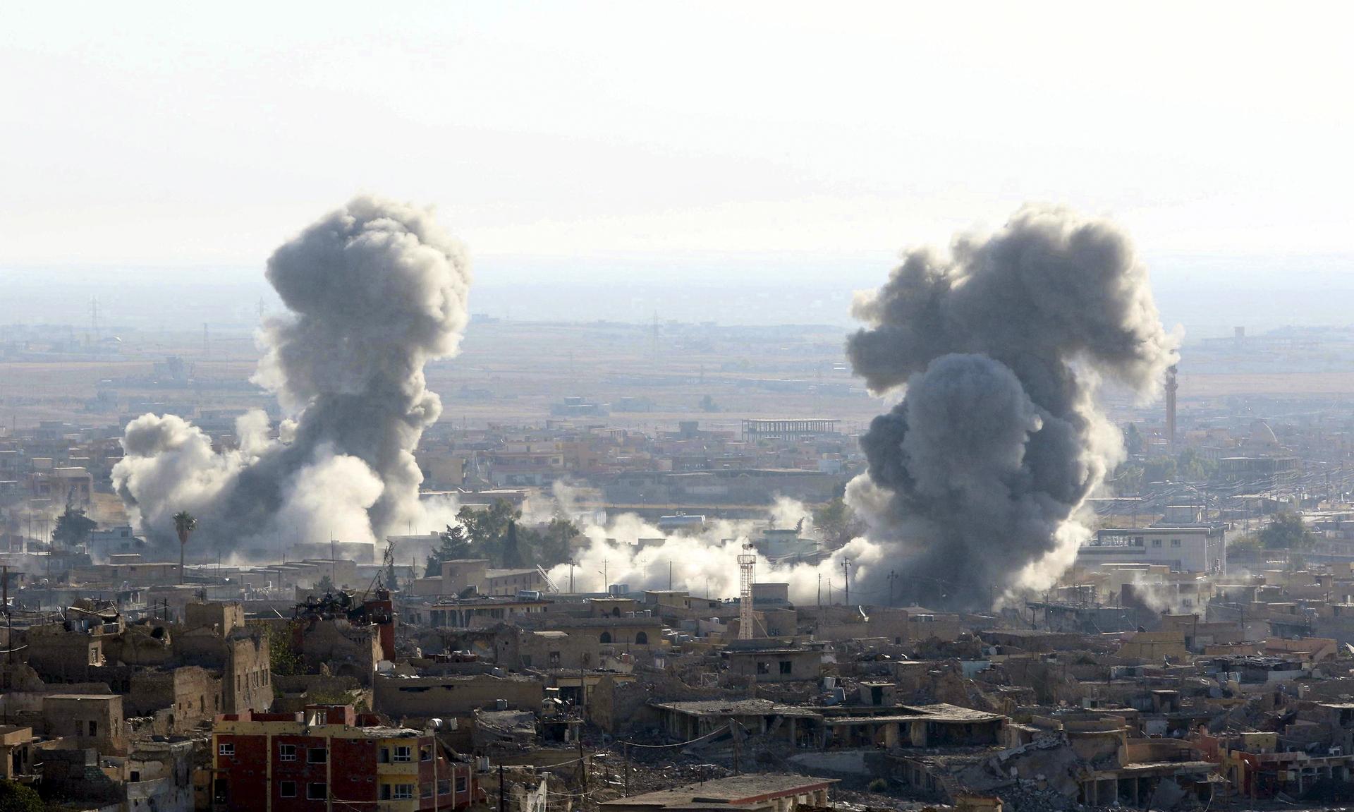 Smoke rises from the site of U.S.-led air strikes in the town of Sinjar, Iraq November 13, 2015.