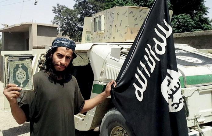 This undated photograph of a man described as Abdelhamid Abaaoud was published by the ISIS online magazine Dabiq and posted on a social media website. He is the Belgian national suspected of being the master planner behind Friday's deadly attacks in Paris