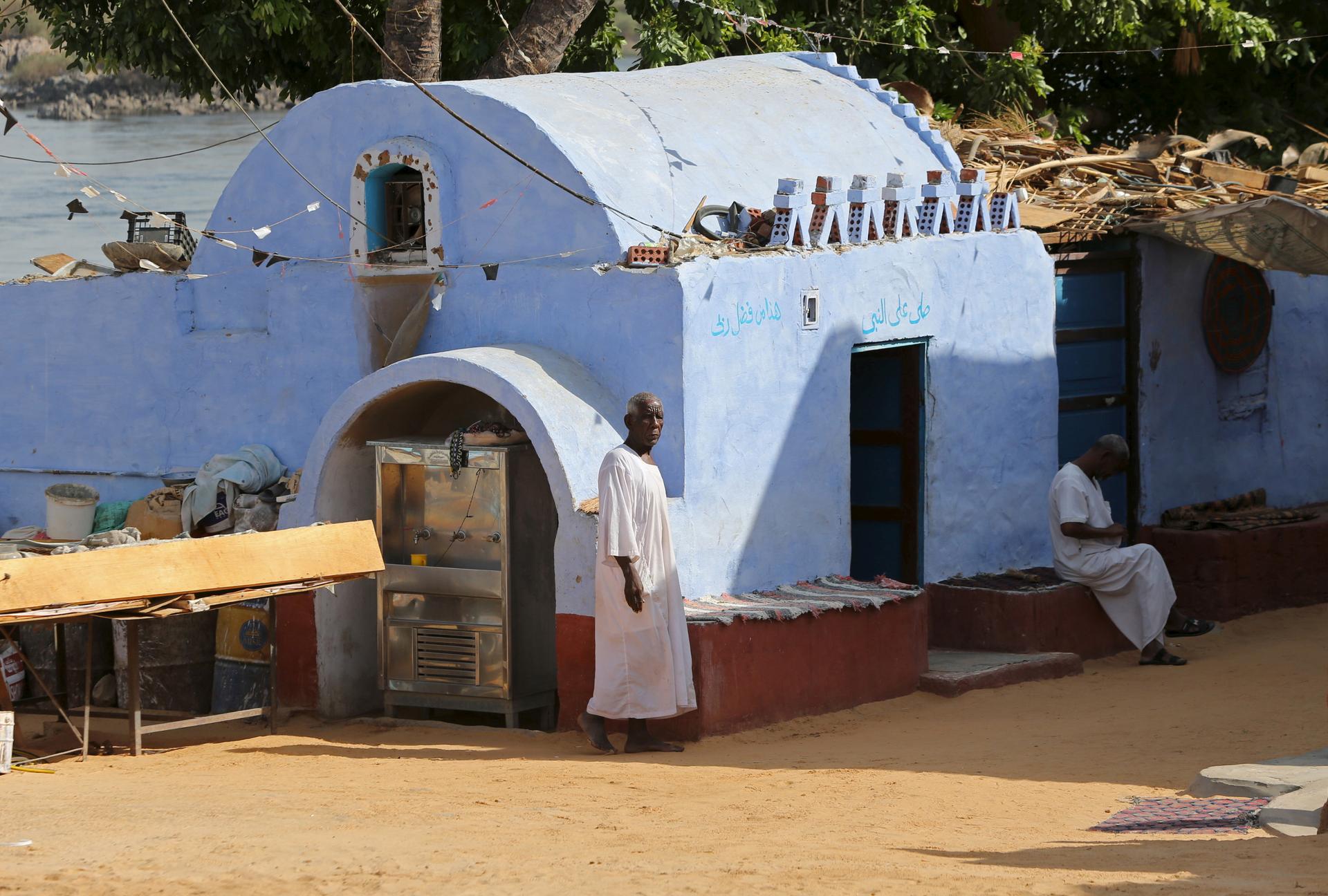A resident looks on from his traditional house at the Nubian Gharb Suheil village, near Aswan, southern Egypt.