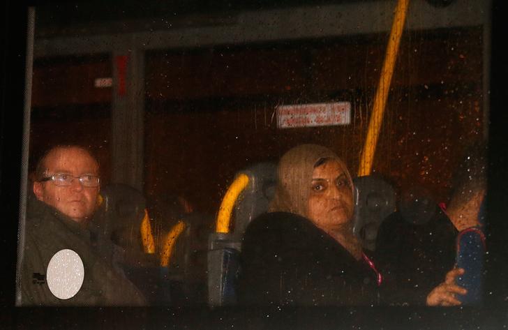 The first group of Syrian refugees to be accepted by Britain, are driven out of Glasgow airport, in Scotland, November 17, 2015. 