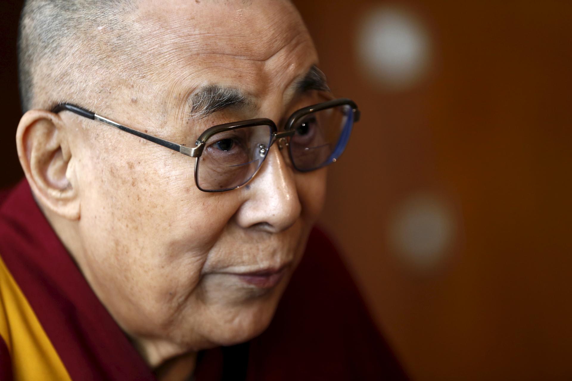 Tibetan spiritual leader the Dalai Lama talks with journalists in Geneva, Switzerland March 11, 2016.