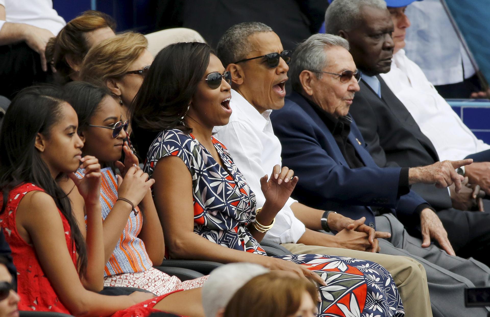 President Barack Obama and his family with Cuban President Raul Castro at an exhibition baseball game between the Cuban National team and the MLB Tampa Bay Rays in Havana.