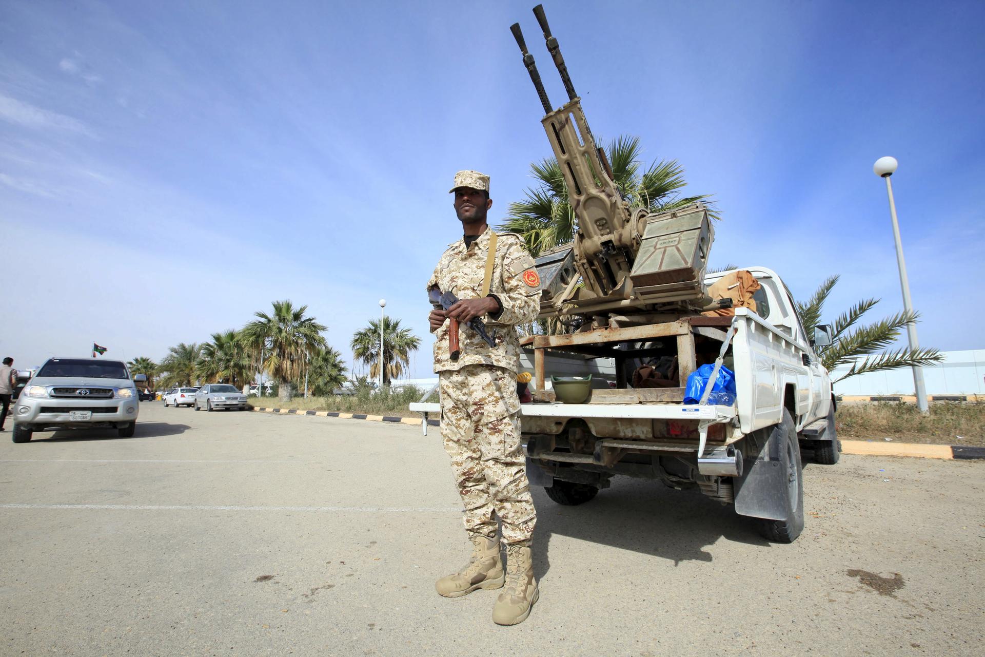 A member of the force assigned to protect Libya's unity government stands on a road leading to new authority's offices in Tripoli, Libya on March 31.
