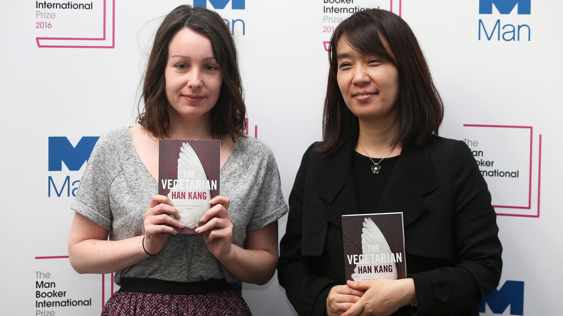 Nominated translator Deborah Smith (L) and author Han Kang pose with their novel "The Vegetarian", during a media event for the Man Booker International Prize 2016, in London, Britain May 15, 2016.