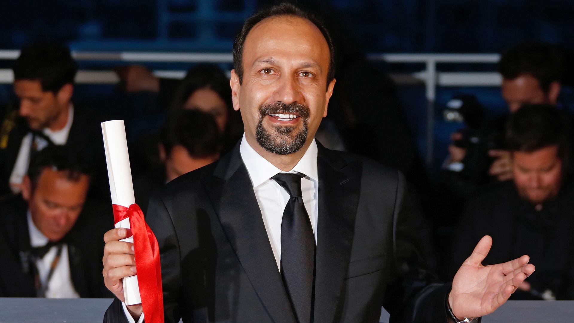 Director Asghar Farhadi, Best screenplay award winner for the film "Forushande" (The Salesman), poses during a photocall after the closing ceremony of the 69th Cannes Film Festival in Cannes, France, May 22, 2016.