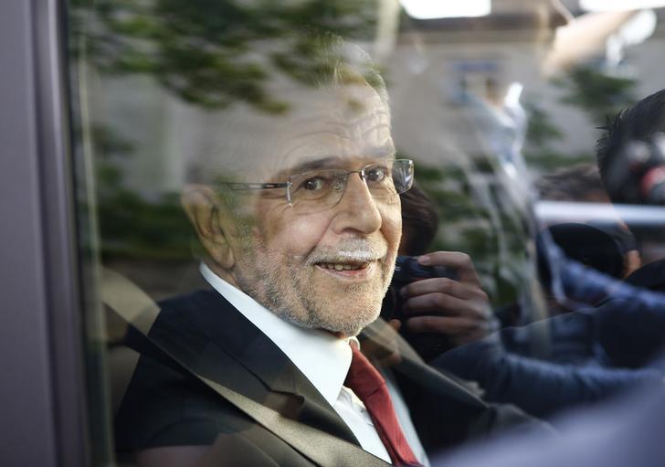 ​Left-wing independent candidate Alexander Van der Bellen smiles out of the window of a car after winning Austrian presidential election in Vienna, Austria,
