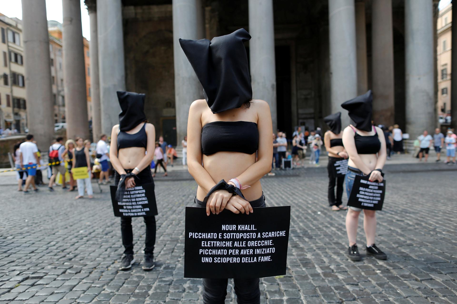 Amnesty International activists take part in a performance to protest against enforced disappearance in downtown Rome, Italy July 13, 2016. REUTERS/Tony Gentile