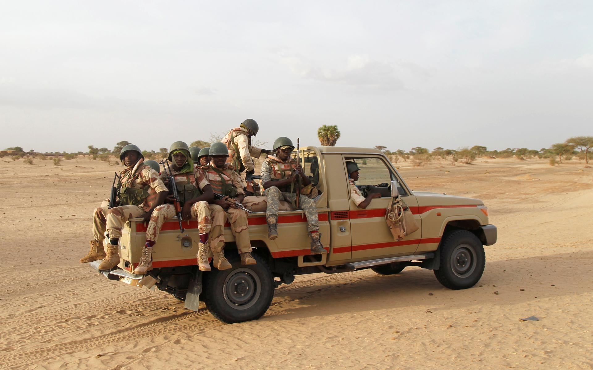 Nigerien soldiers patrol at the border with neighbouring Nigeria near the town of Diffa.