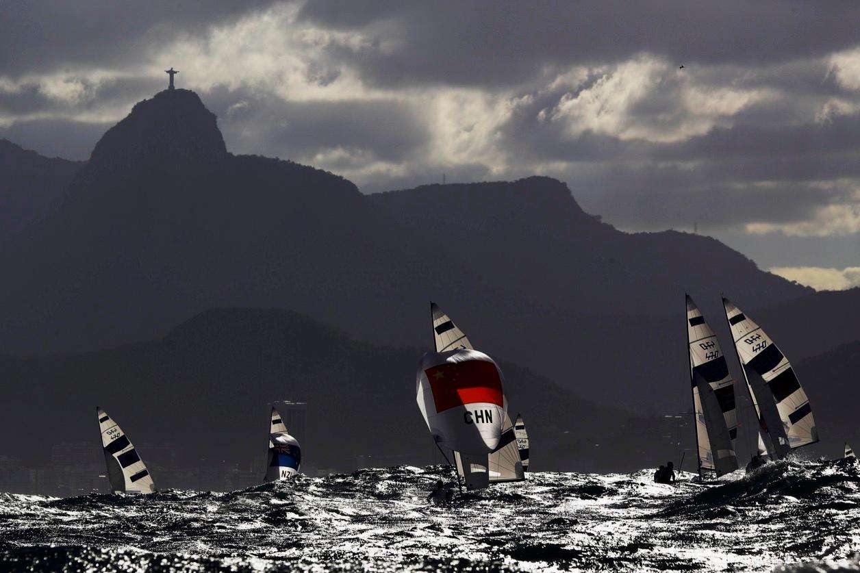 Sailors compete under the Christ the Redeemer statue at the 2016 Rio Olympics.