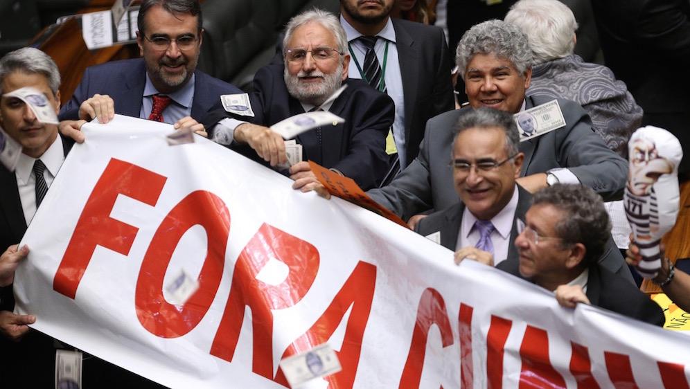 Brazilian lawmakers celebrate the "yes" vote to remove former Speaker Eduardo Cunha, in Brasilia on Sept. 12.