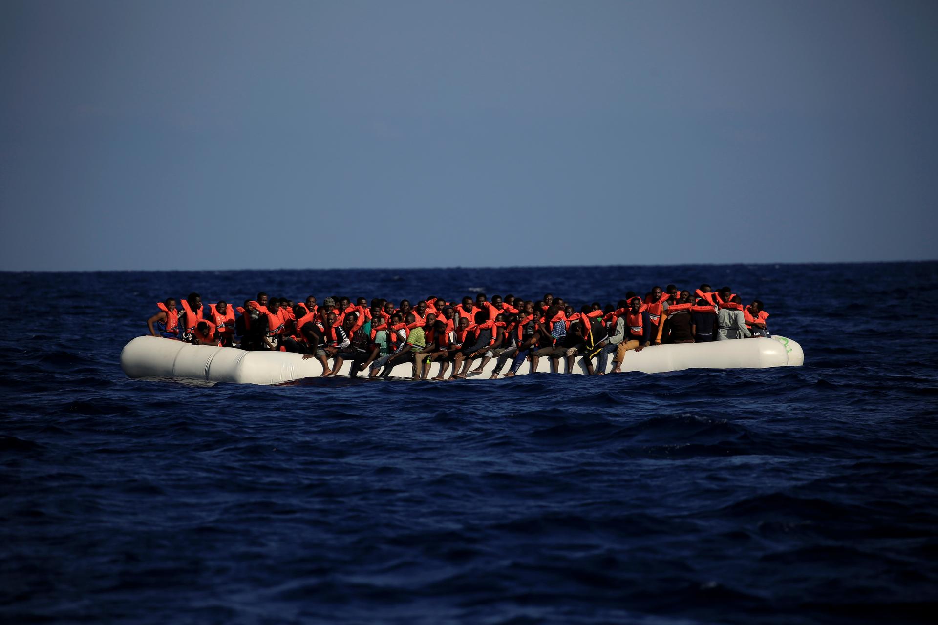 An overcrowded dinghy with migrants from different African countries is seen after members of the German NGO Jugend Rettet guided them towards the Iuventa vessel during a rescue operation, off the Libyan coast in the Mediterranean Sea September 21, 2016.