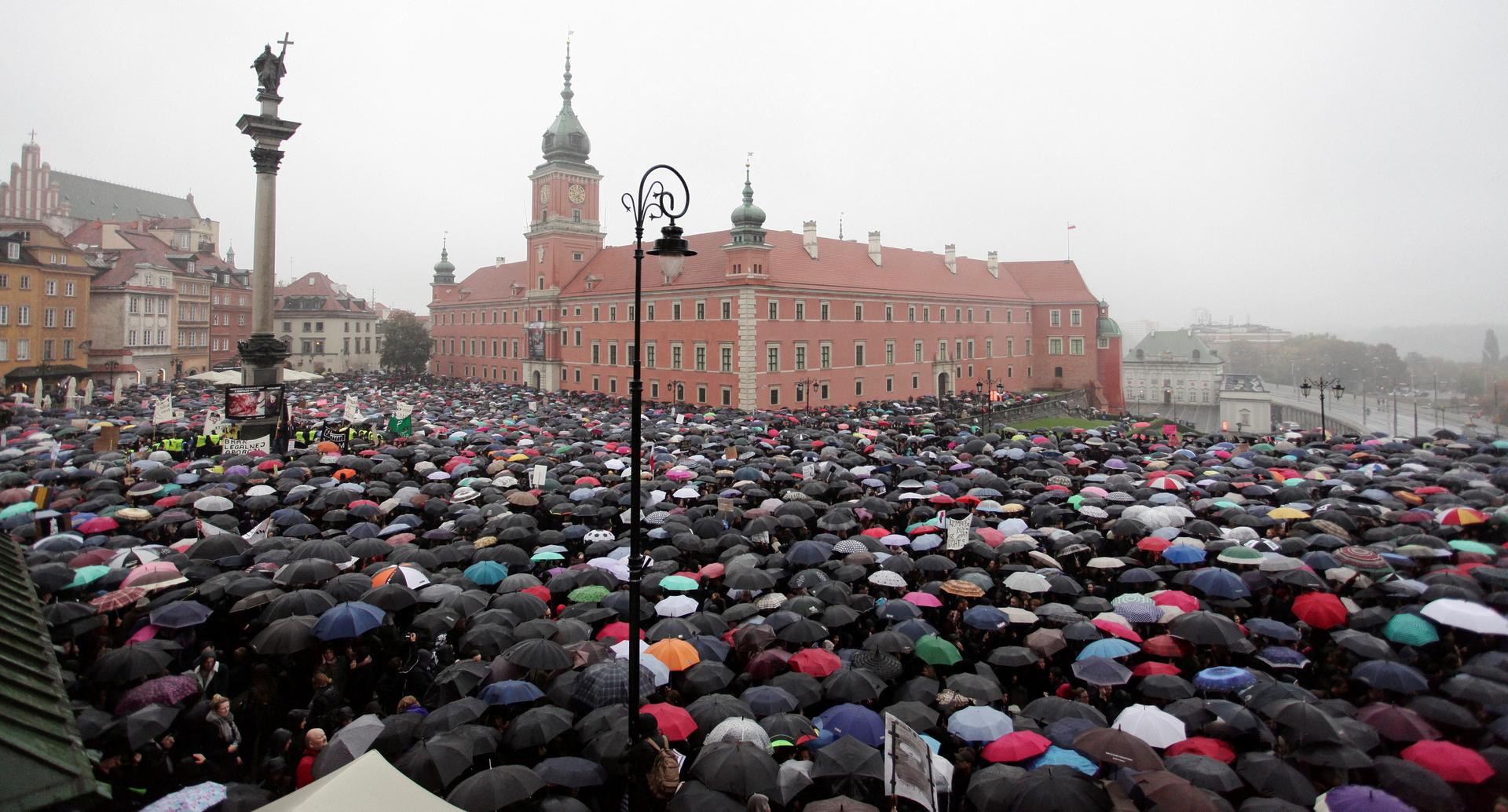 Thousands of people gather during an abortion rights campaigners' demonstration to protest plans for a total ban on abortion in front of the Royal Castle in Warsaw, Poland, on Oct. 3, 2016.