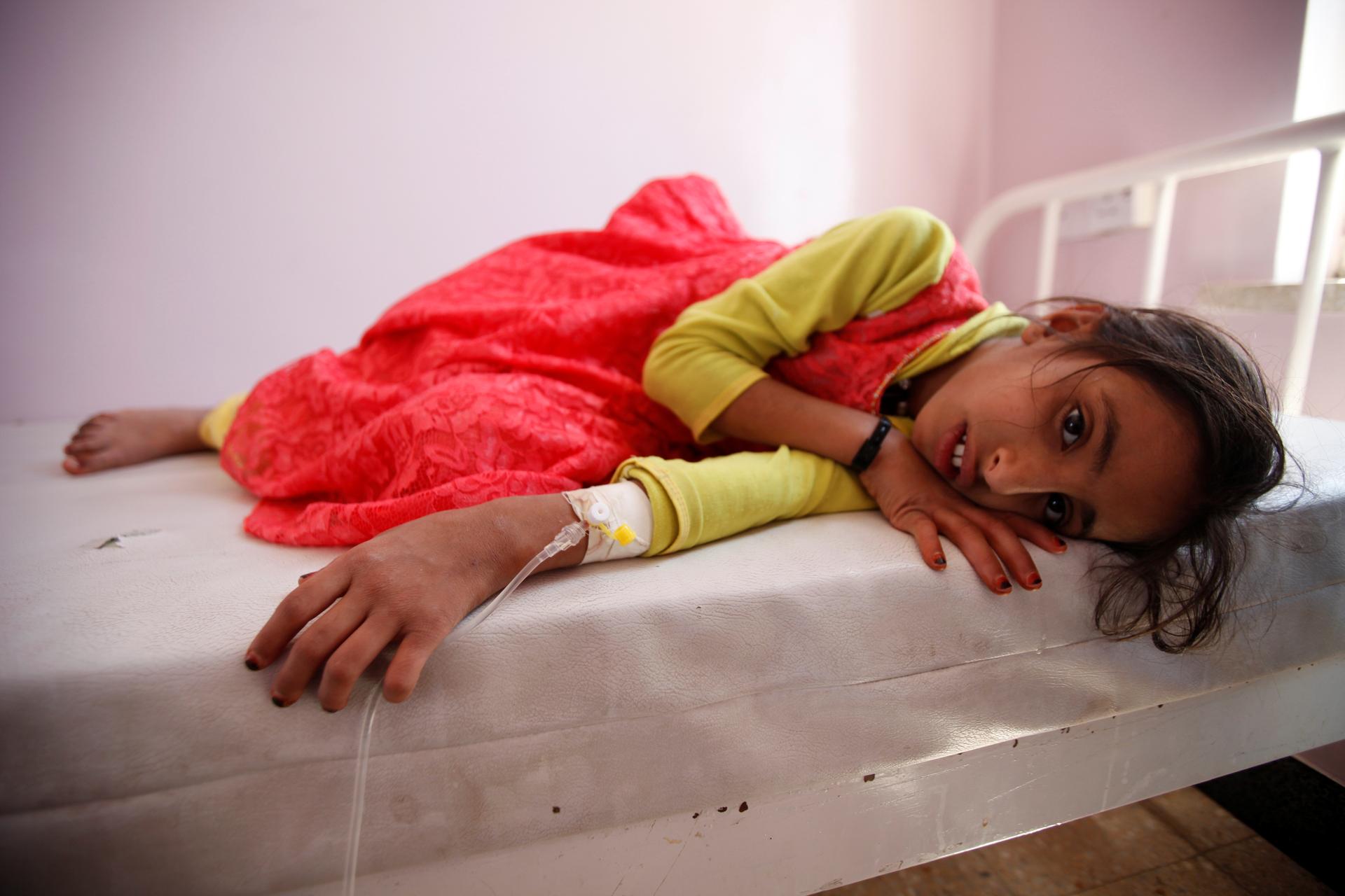 A child with cholera lays silently on a hospital gurney in Sanaa, Yemen in October 2016, The May 2017 outbreak is more widespread.