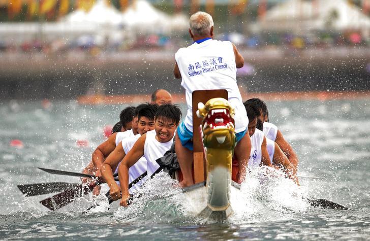 Competitors in action during the Hong Kong Dragon Boat Festival that features three days of races and parties. 