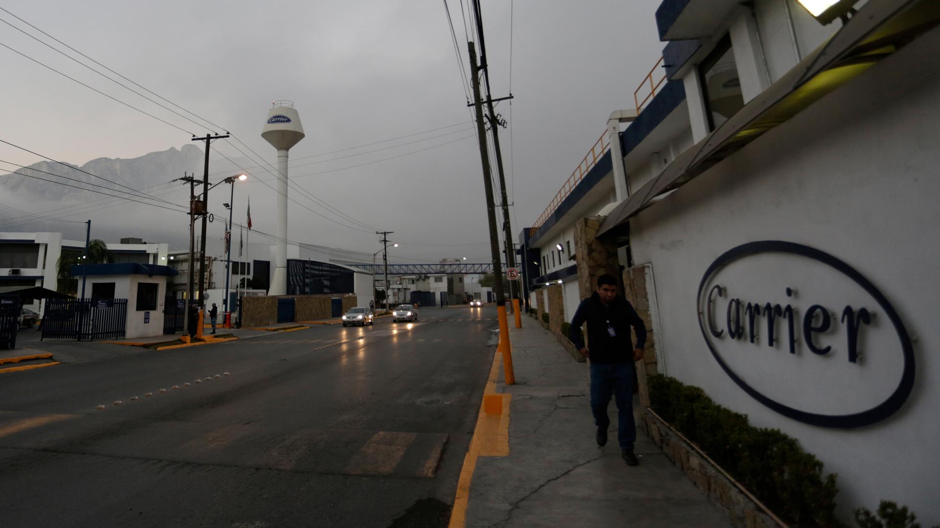 A worker walks past the Carrier plant in Santa Catarina, on the outskirts of Monterrey, Mexico. One of Trump's campaign promises was to prevent further Indiana-based Carrier jobs from moving to Mexico. 
