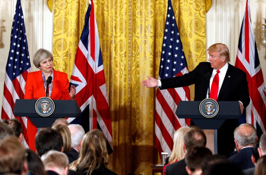 British Prime Minister Theresa May listens as US President Donald Trump speaks during their joint news conference at the White House in Washington, on Jan. 27.