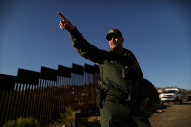 A U.S. border agent patrols the U.S. border with Mexico in Nogales, Arizona, U.S., January 31, 2017. 