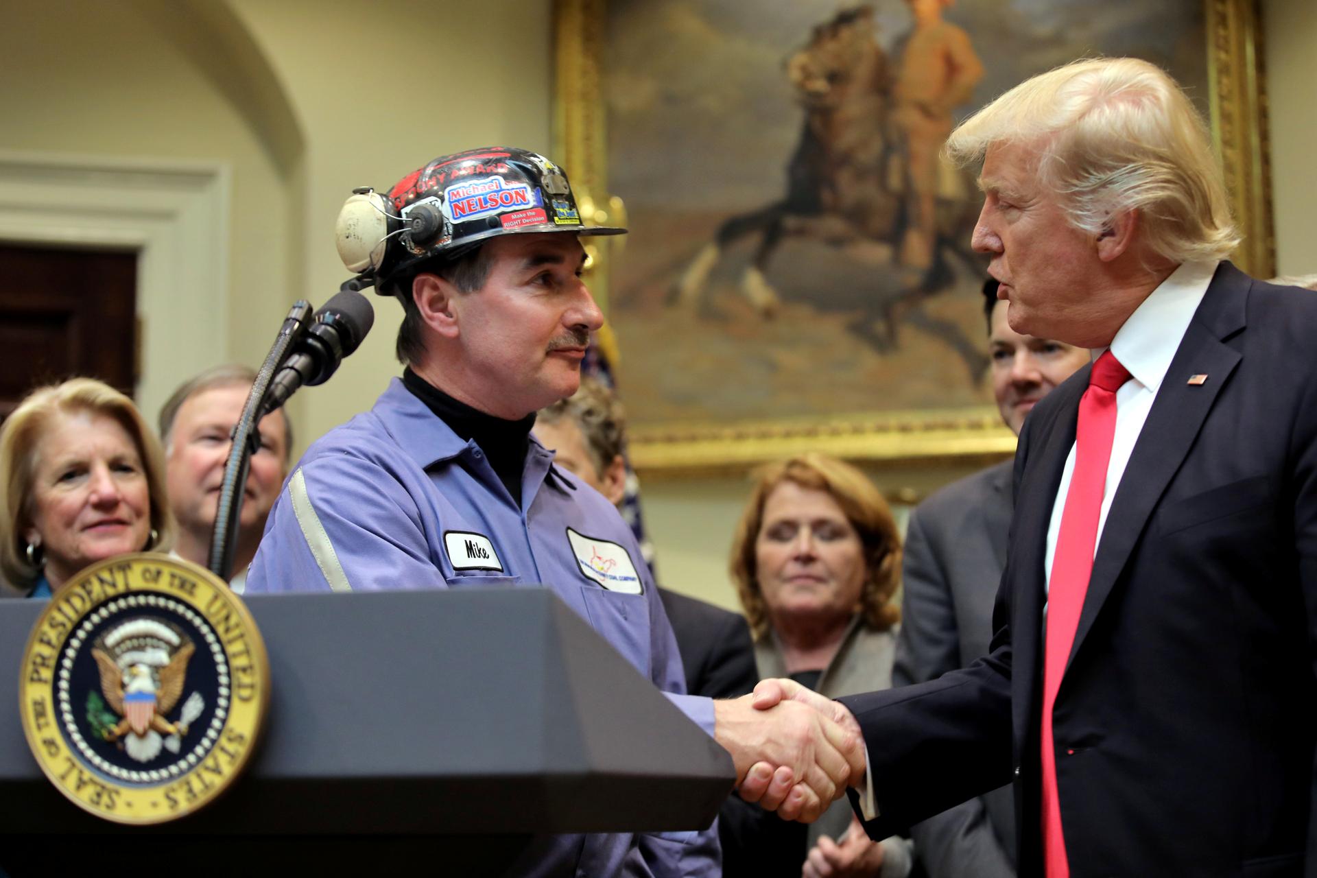 President Trump shakes hands with a coal miner