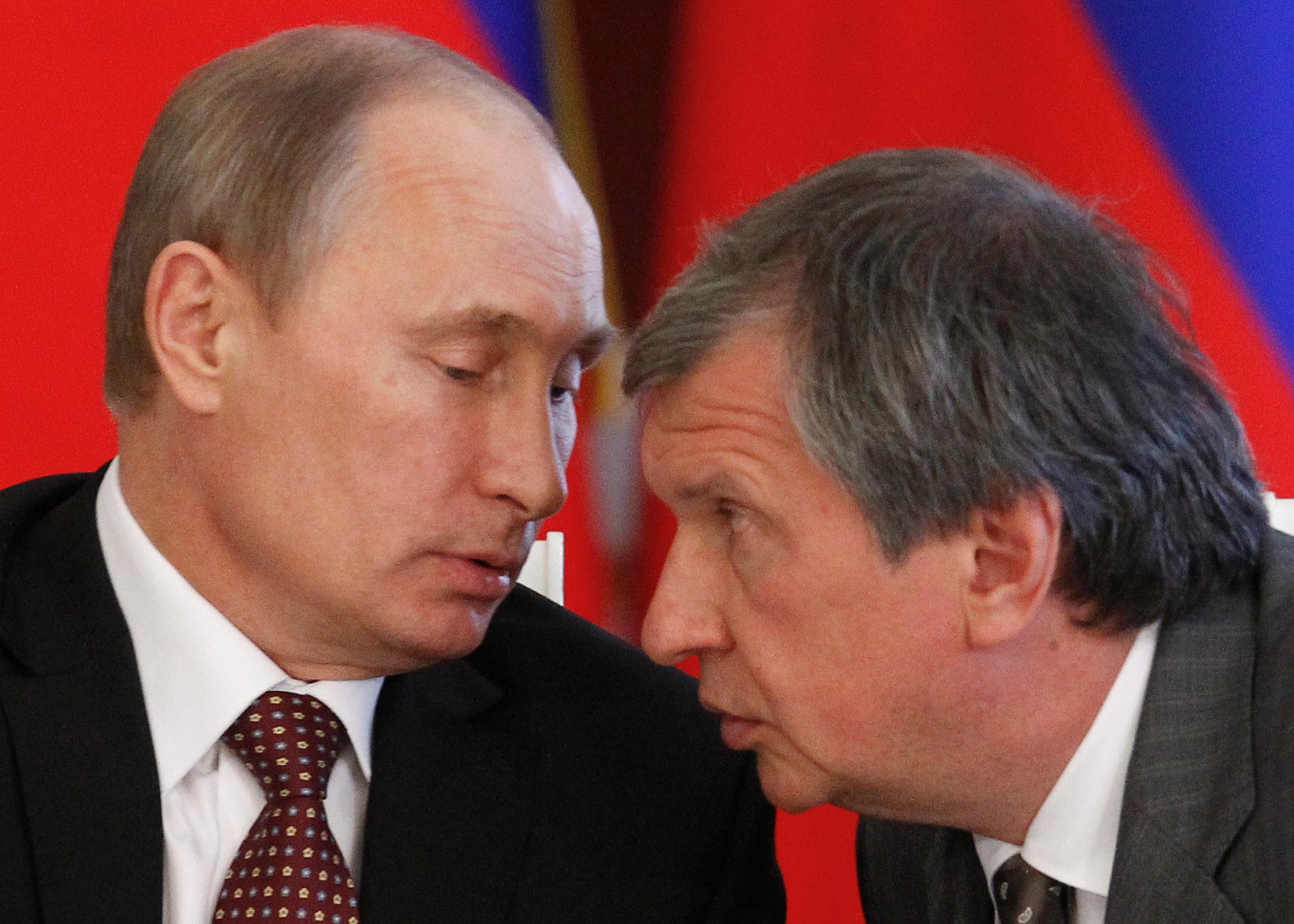 Russian President Vladimir Putin talks to Rosneft President and close adviser Igor Sechin.  Sechin is said to be the second most powerful man in Russia. 