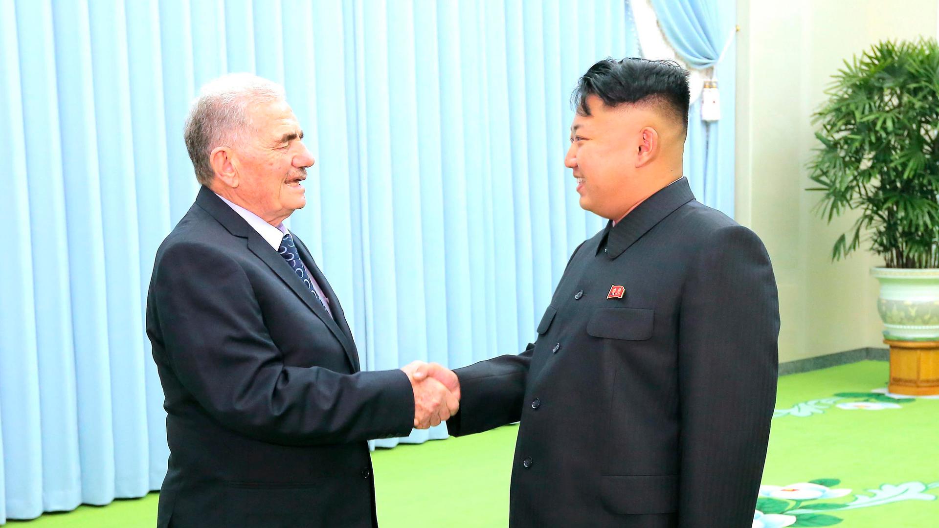 North Korean leader Kim Jong-un (R) meeting Abdullah al-Ahmar, deputy general secretary of Syria's ruling Baath Party, on a visit to Pyongyang in 2013
