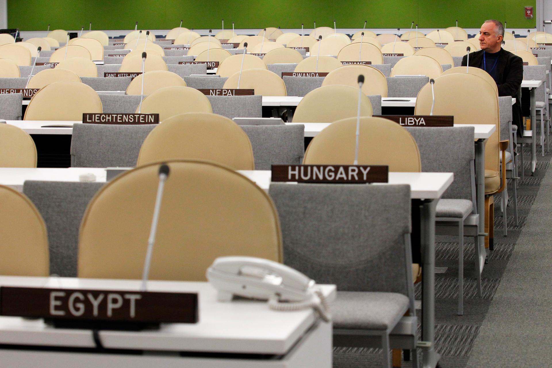 A U.N. worker rests after checking the temporary General Assembly Hall at the U.N. headquarters ahead to the start of the UN general assembly in New York.