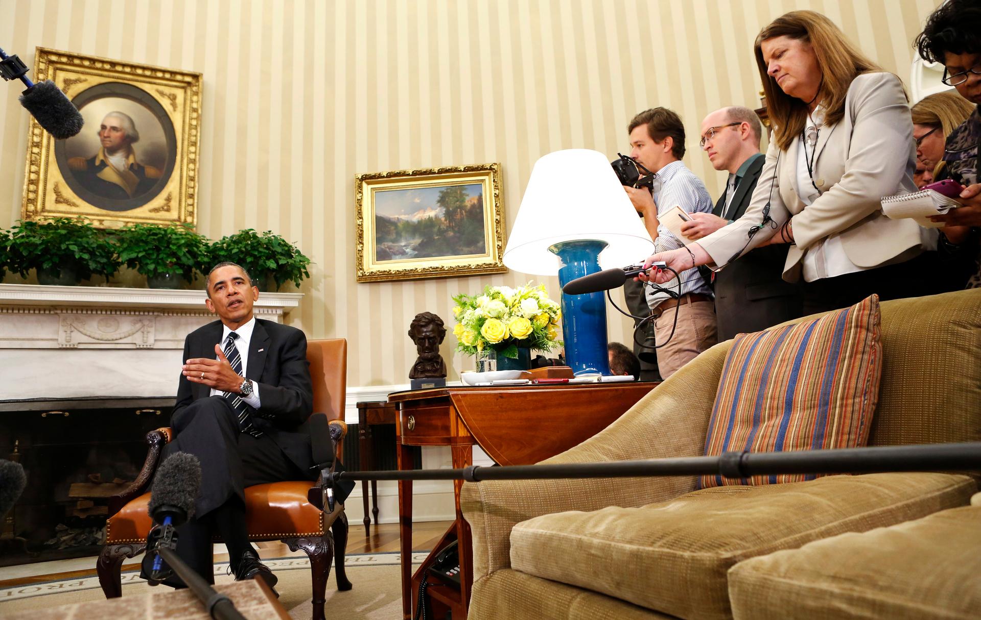 US President Barack Obama speaks to reporters about Syria in the Oval Office of the White House on September 27, 2013.
