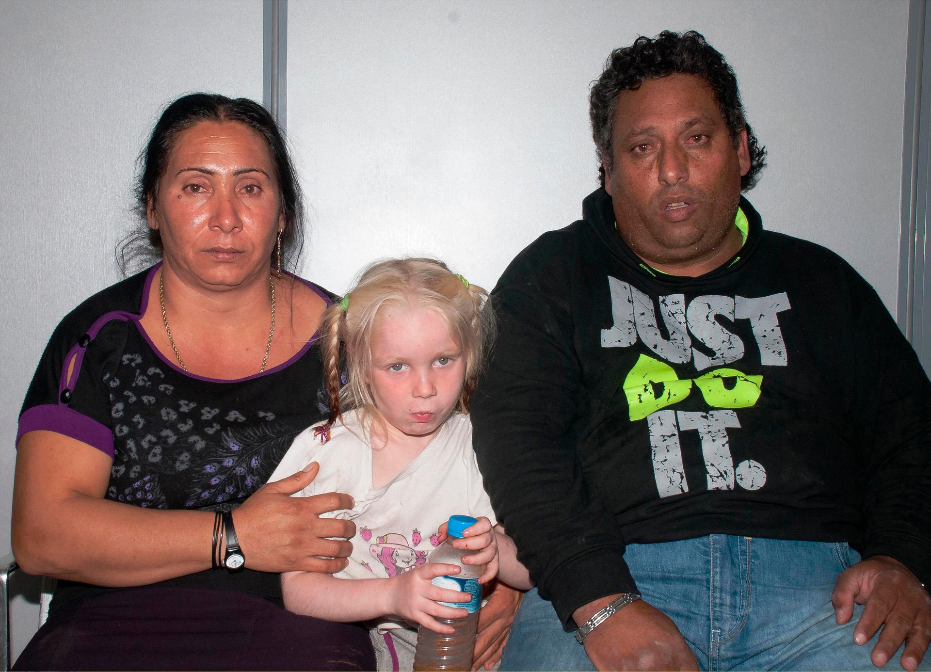 Forty-year-old Roma woman by the name Selini Sali or Eleftheria Dimolpoulou, 39-year-old Roma man by the name Christos Salis (R) and a girl found living with them in central Greece, are seen in a handout photo distributed by the Greek police.