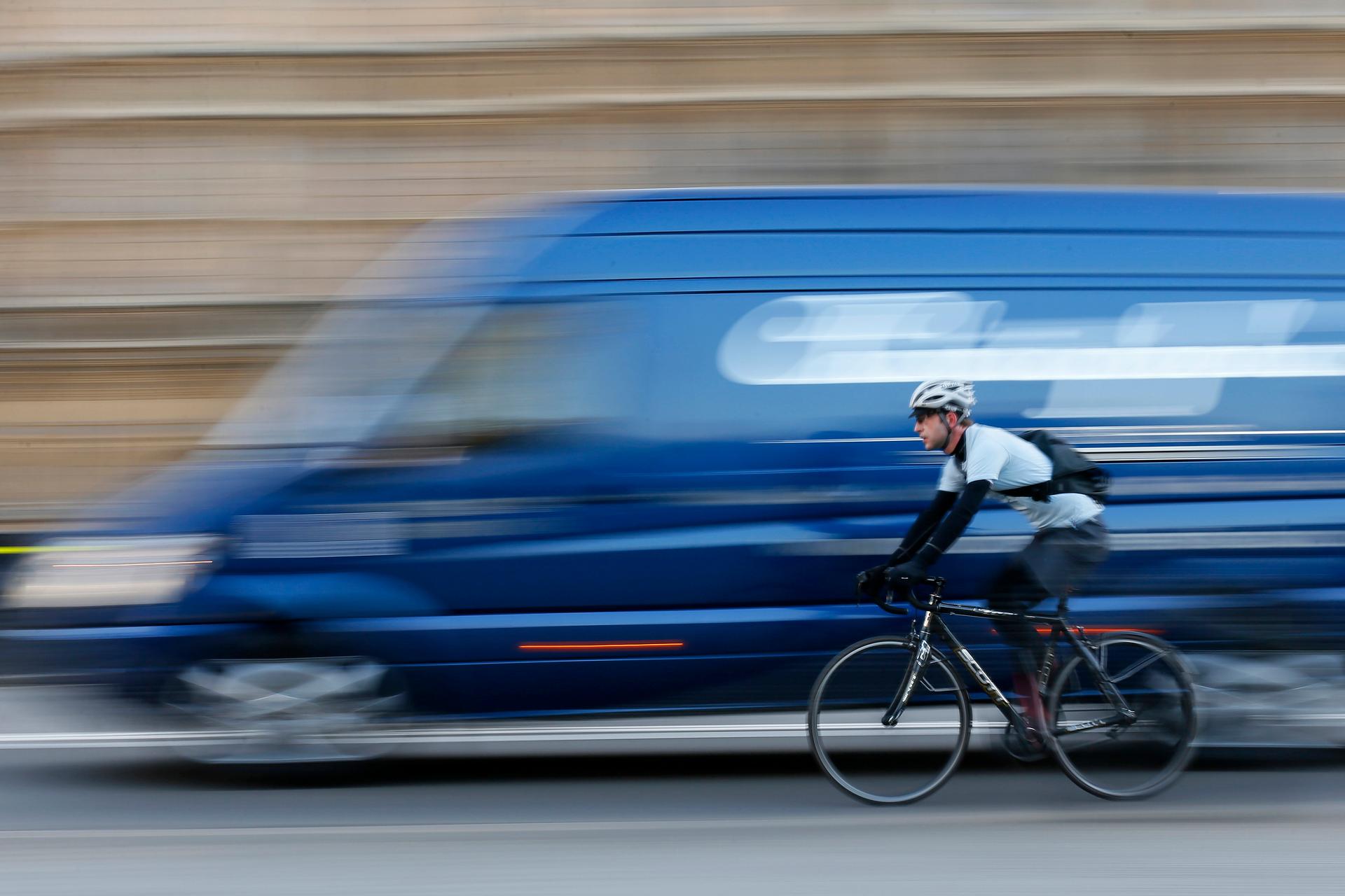 A commuter cycles in central London on November 15, 2013. The deaths of five cyclists in just nine days on the road this month in London have prompted calls for the city to speed up road safety measures in the capital.