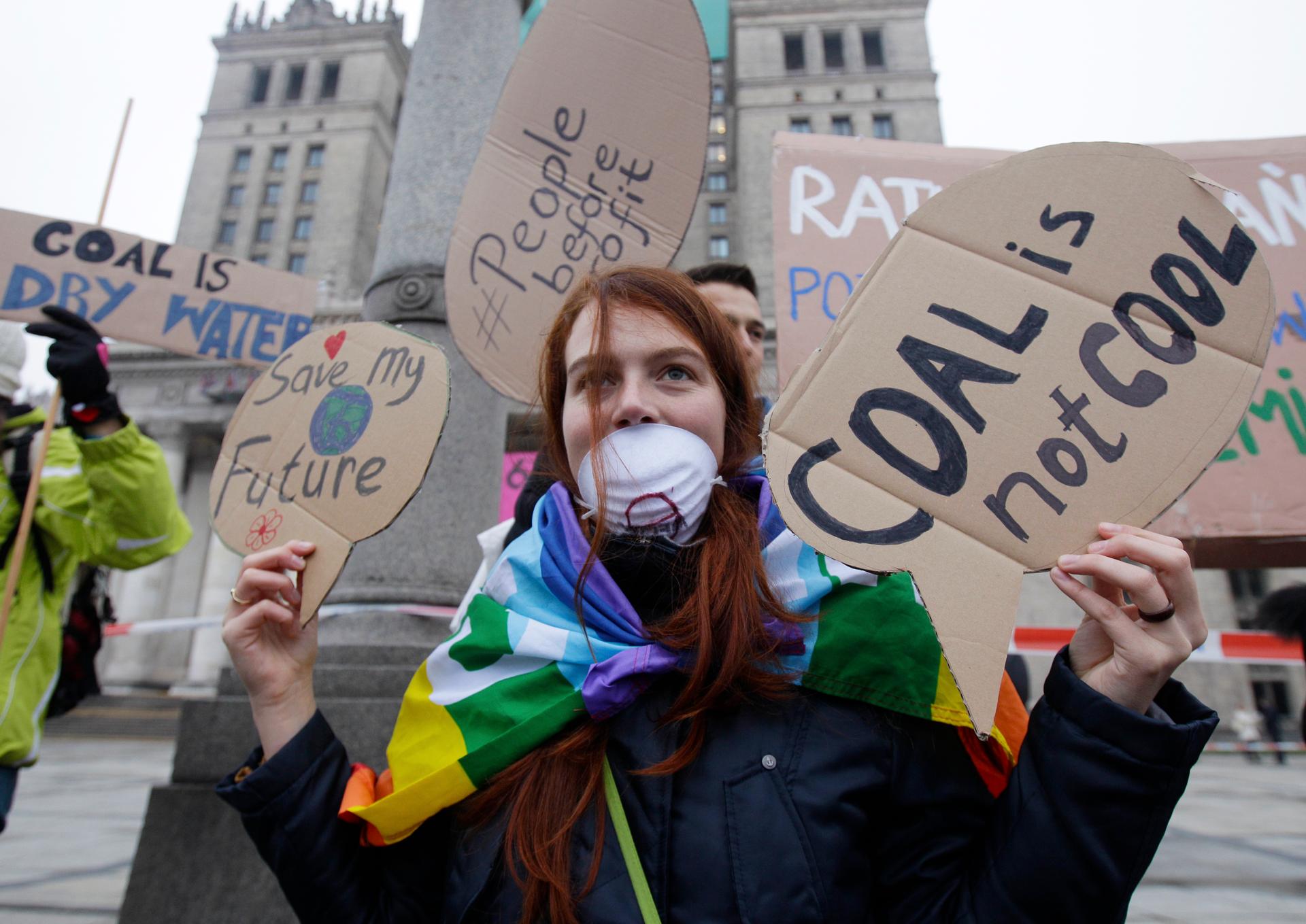 Activists protest during UN Climate Change talks in Warsaw, Poland.