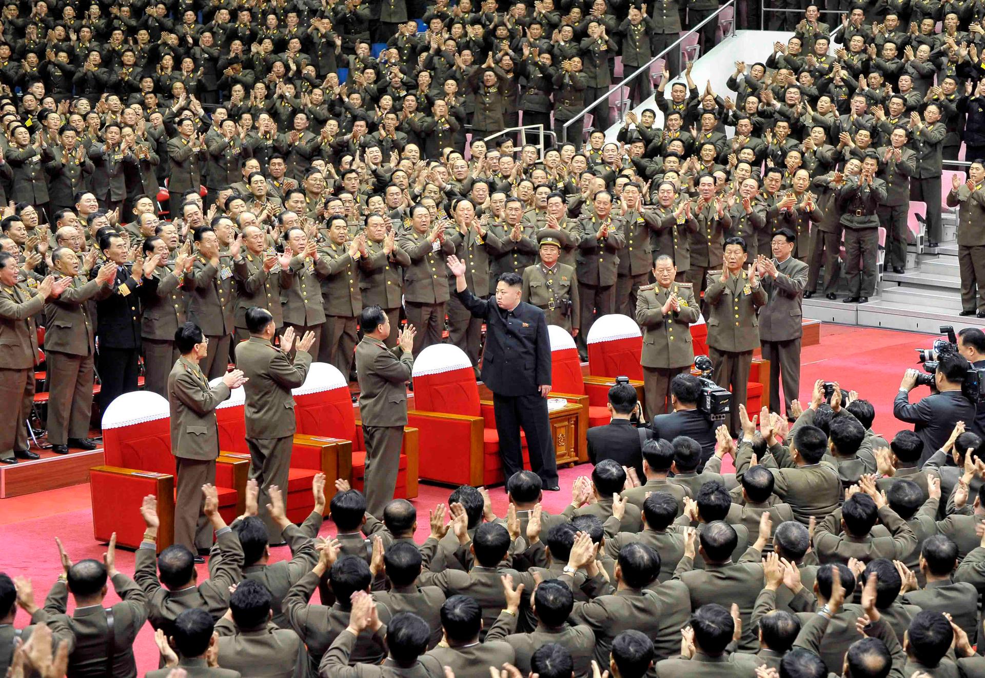 North Korean leader Kim Jong Un waves during a performance by the State Merited Chorus in this undated photo released by North Korea's Korean Central News Agency (KCNA) in Pyongyang November 22, 2013. 