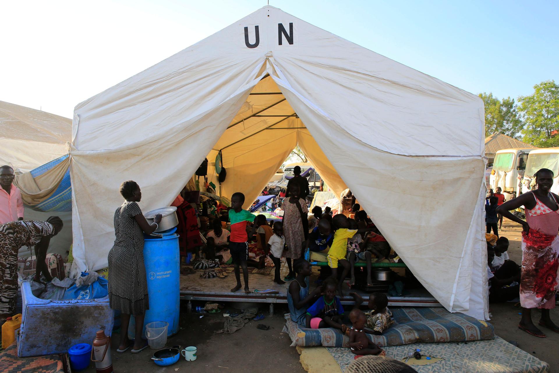 Displaced people stay in makeshift tents inside Tomping United Nations base