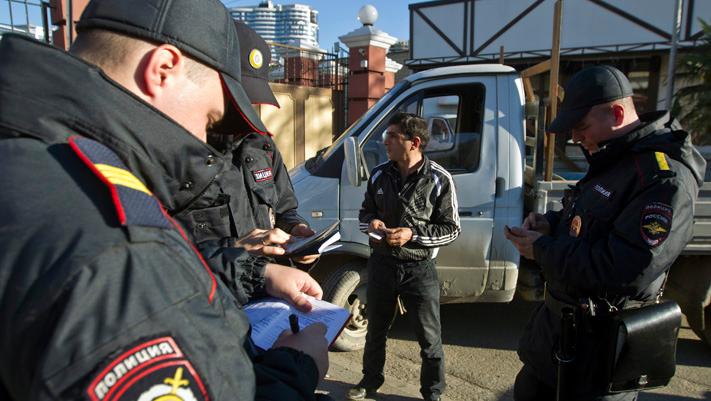 Russian police check a driver's documents in Sochi December 30, 2013.