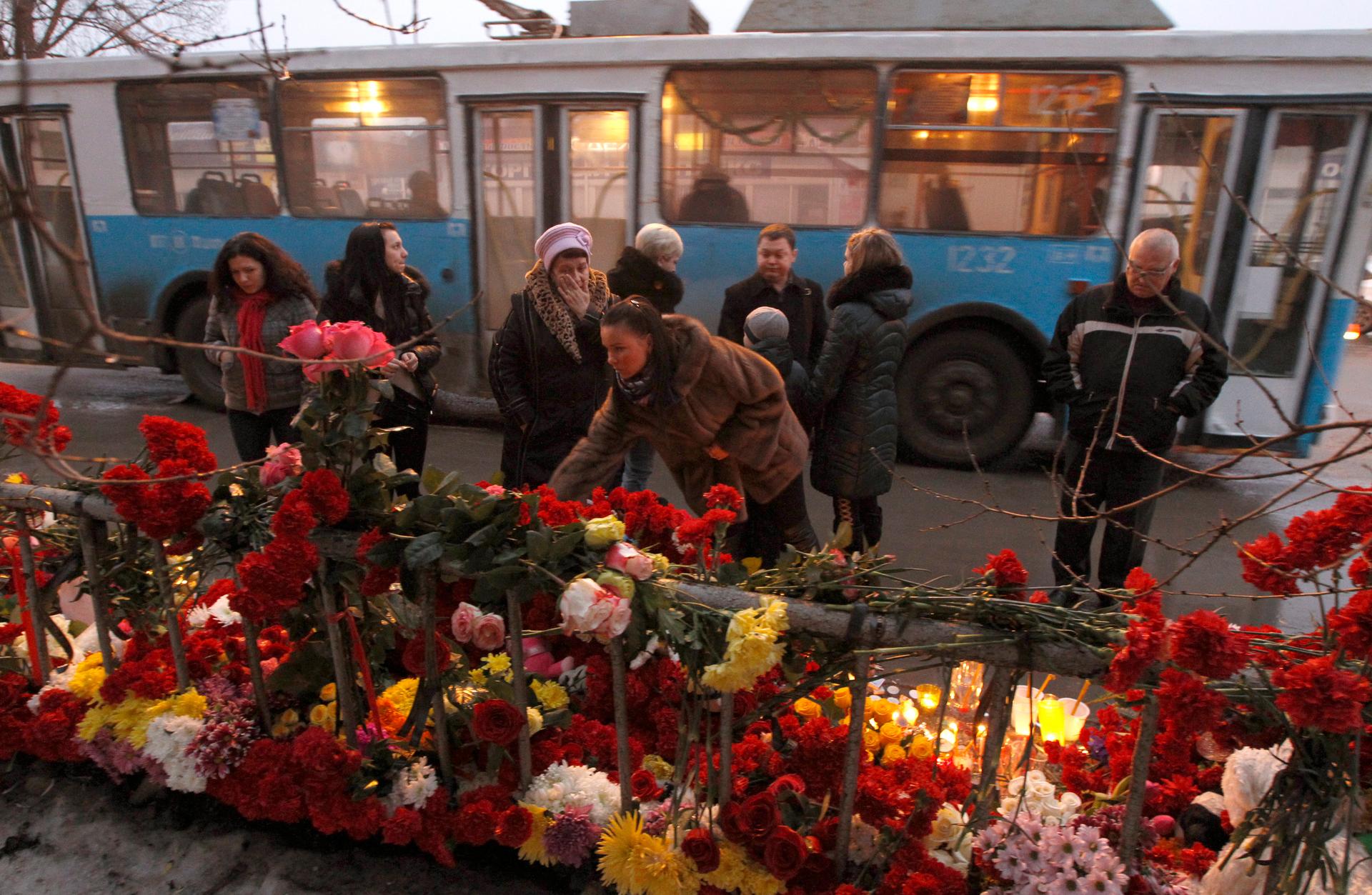 People gather at the site of an explosion on a trolley bus in Volgograd, December 31, 2013