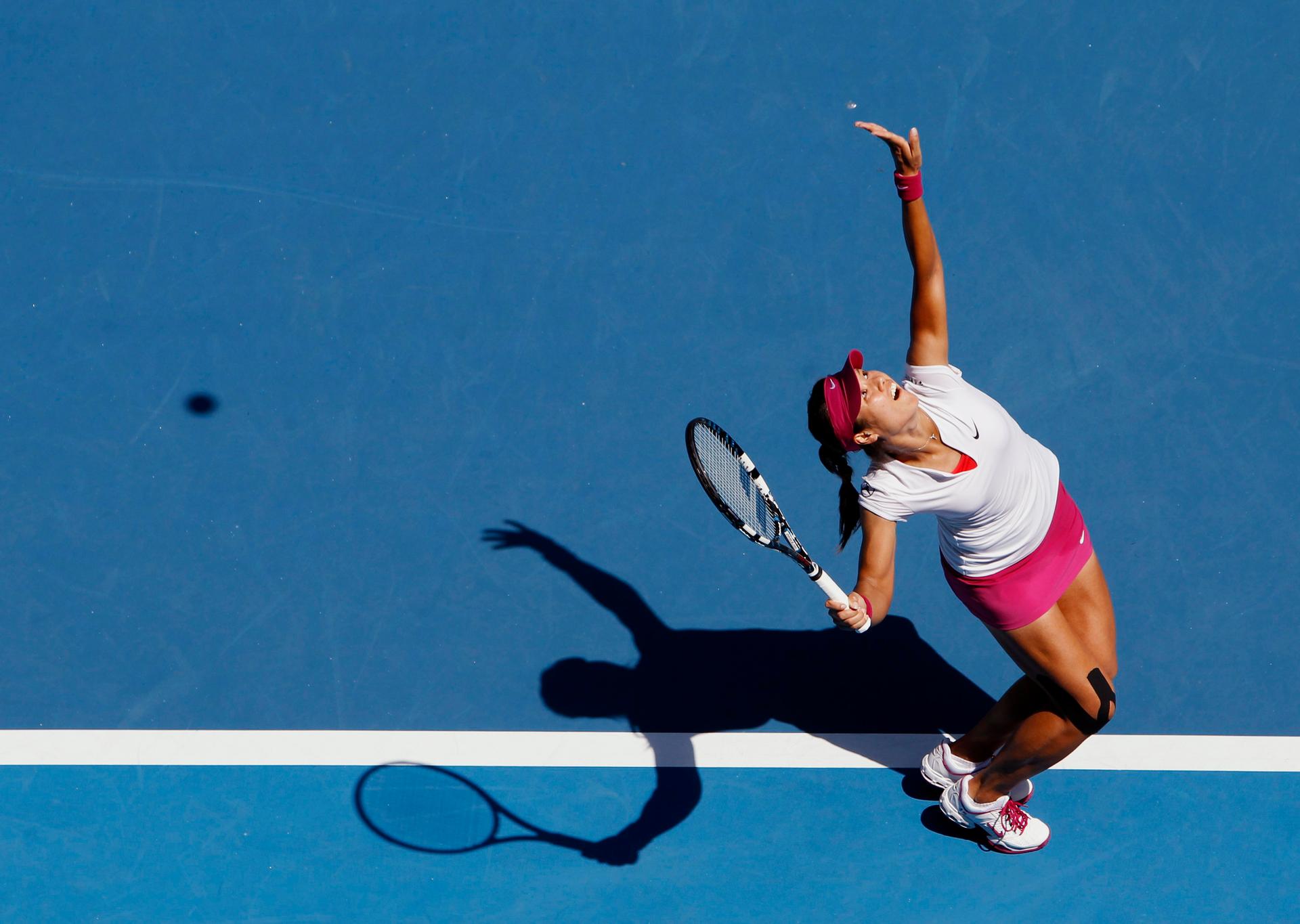 Li Na of China serves to Lucie Safarova of the Czech Republic during their women's singles match at the Australian Open 2014 tennis tournament in Melbourne January 17, 2014.