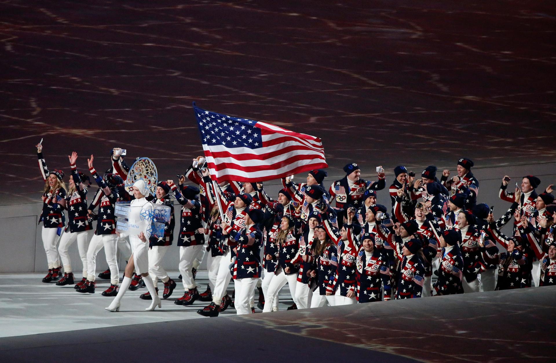 Flag-bearer Todd Lodwick of the U.S. leads his country's contingent during the athletes' parade at the opening ceremony of the Sochi 2014 Winter Olympic Games February 7, 2014. REUTERS/Grigory Dukor (RUSSIA - Tags: OLYMPICS SPORT)
