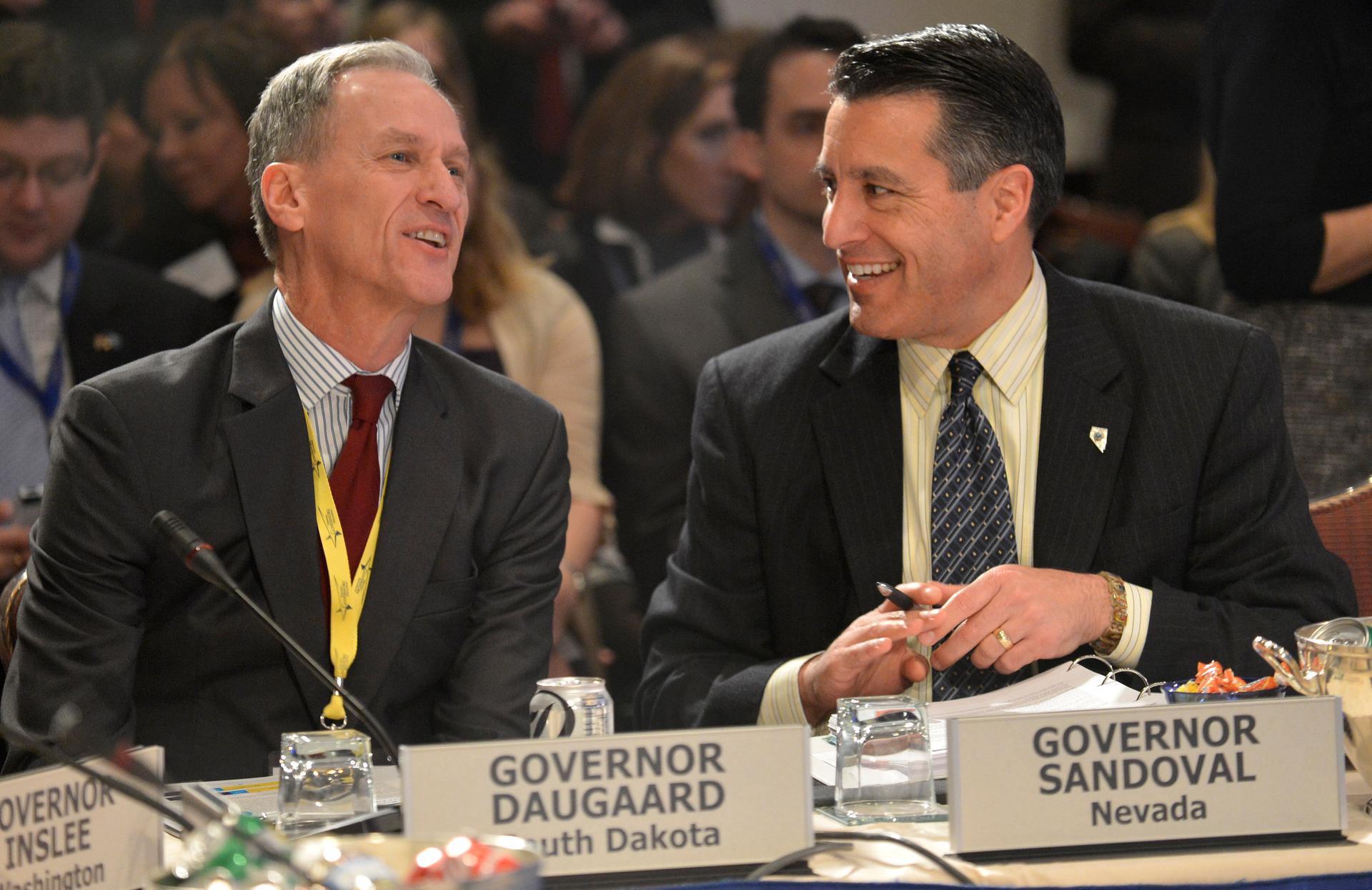 South Dakota Gov. Dennis Daugaard, left, was called out by the Justice Department which says his state has funneled disabled people into nursing homes.