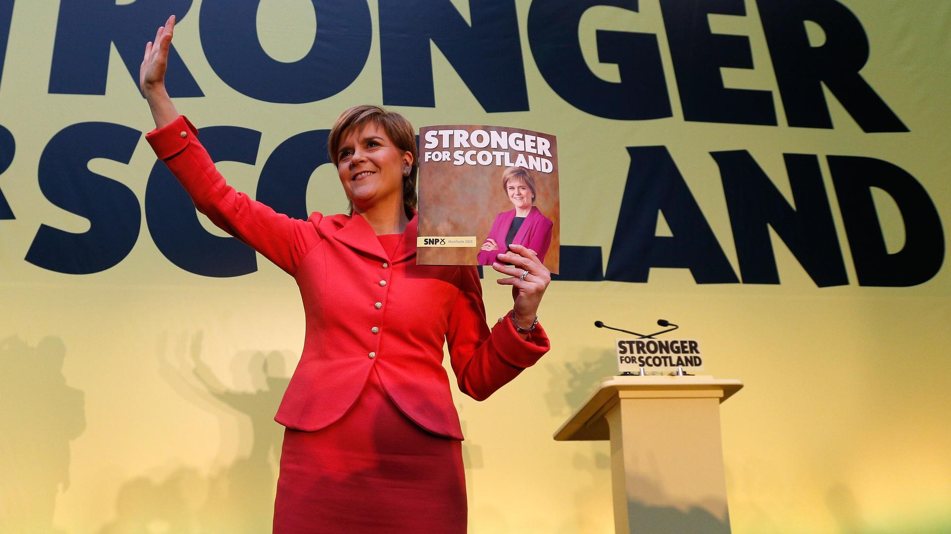 Scottish National Party leader Nicola Sturgeon display the SNP's election manifesto in Edinburgh, Scotland, on April 21, 2015.