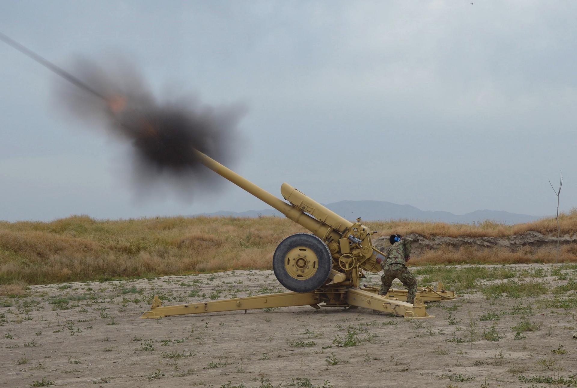 Afghan National Army soldiers fire artillery during a battle with Taliban insurgents in Kunduz on April 29, 2015.
