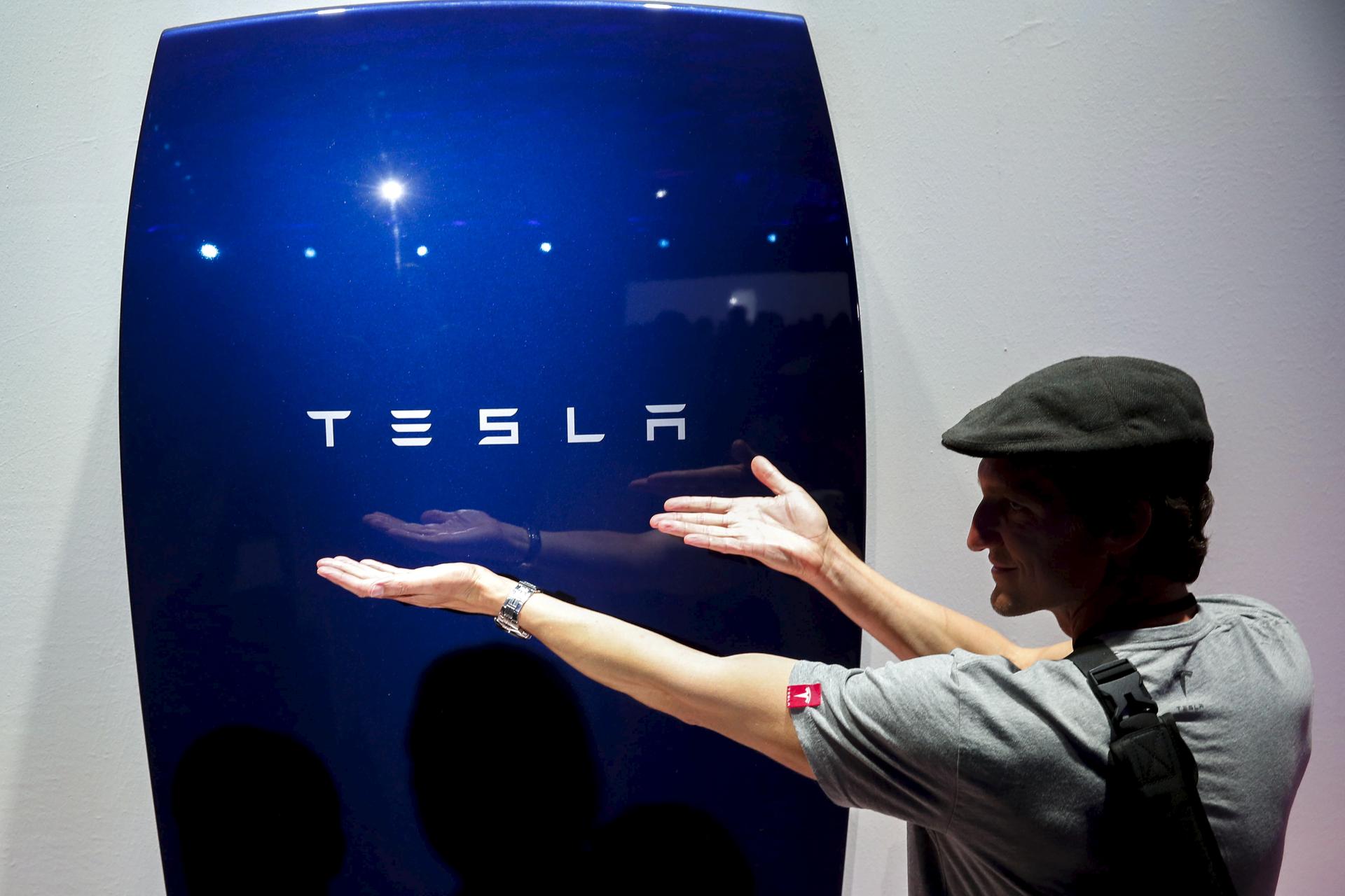 Attendees take pictures of the new Tesla Energy Powerwall Home Battery during an event at Tesla Motors in Hawthorne, California, on April 30, 2015.