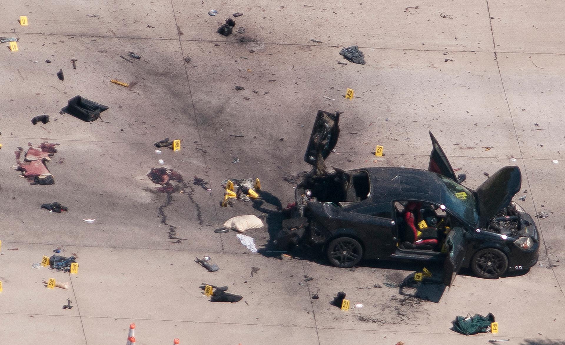 An aerial view shows the car that was used the previous night by two gunmen, who were killed by police, as it is investigated by local police and the FBI in Garland, Texas May 4, 2015.