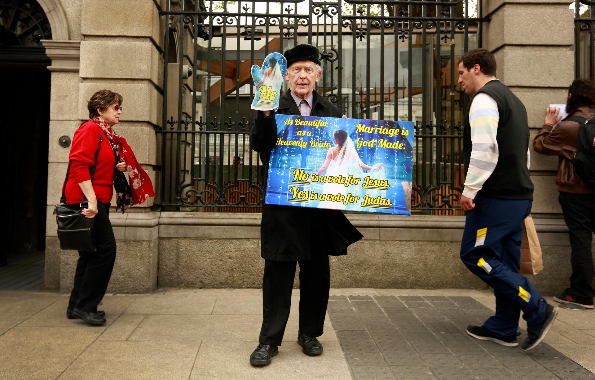 A ‘No’ campaigner, opposed to the legalization of same-sex marriage, delivers his message on the sidewalk in Dublin on May 20, 2015.