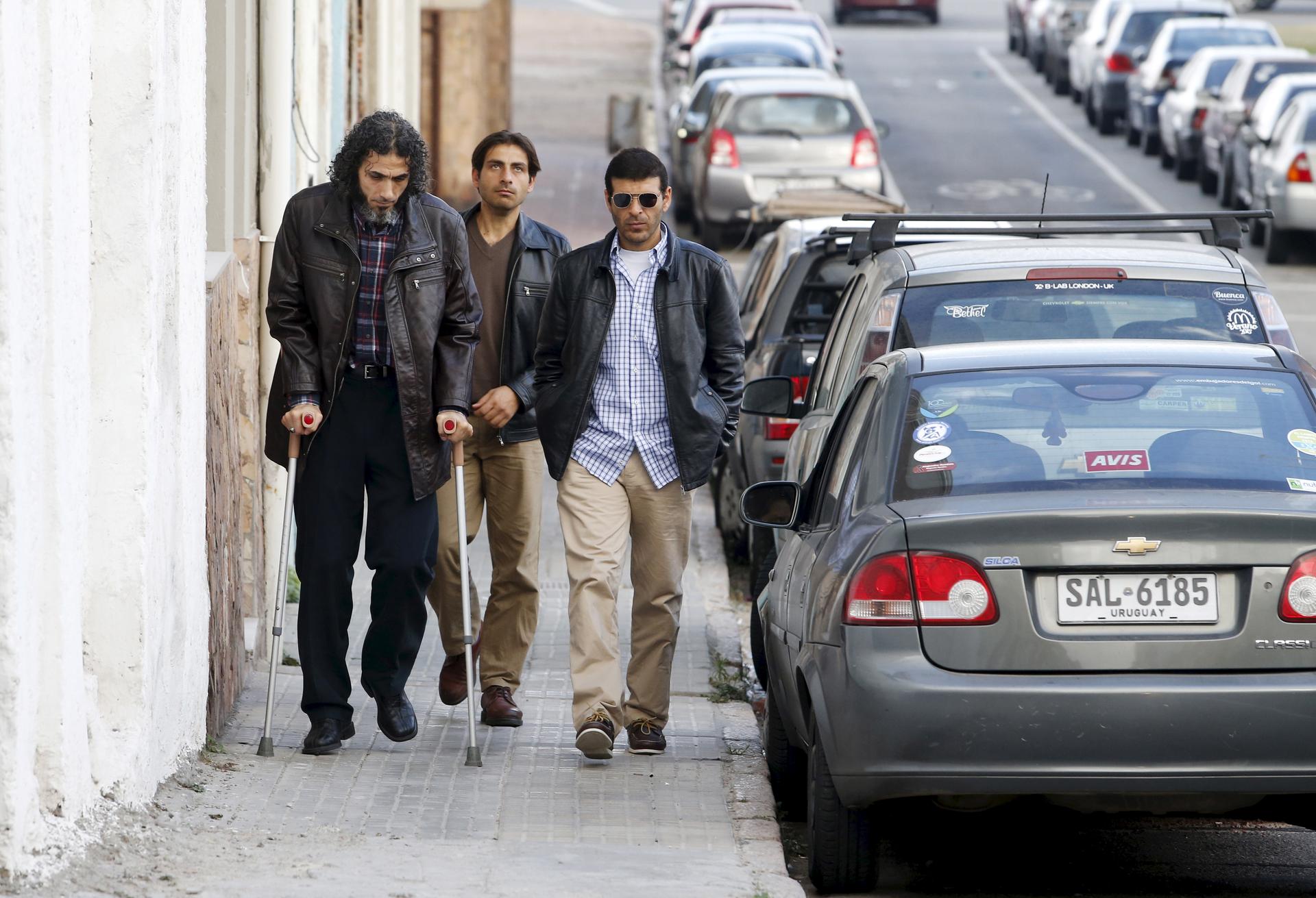 Former Guantanamo detainees from Syria (L-R) Jihad Diyab, Ahmed Adnan Ahjam and Ali Hussain Shaabaan, arrive to attend the wedding of fellow ex-detainee Abdul Bin Mohammed Abis Ourgy (not pictured) of Tunisia, in Montevideo, June 5, 2015. They are part of