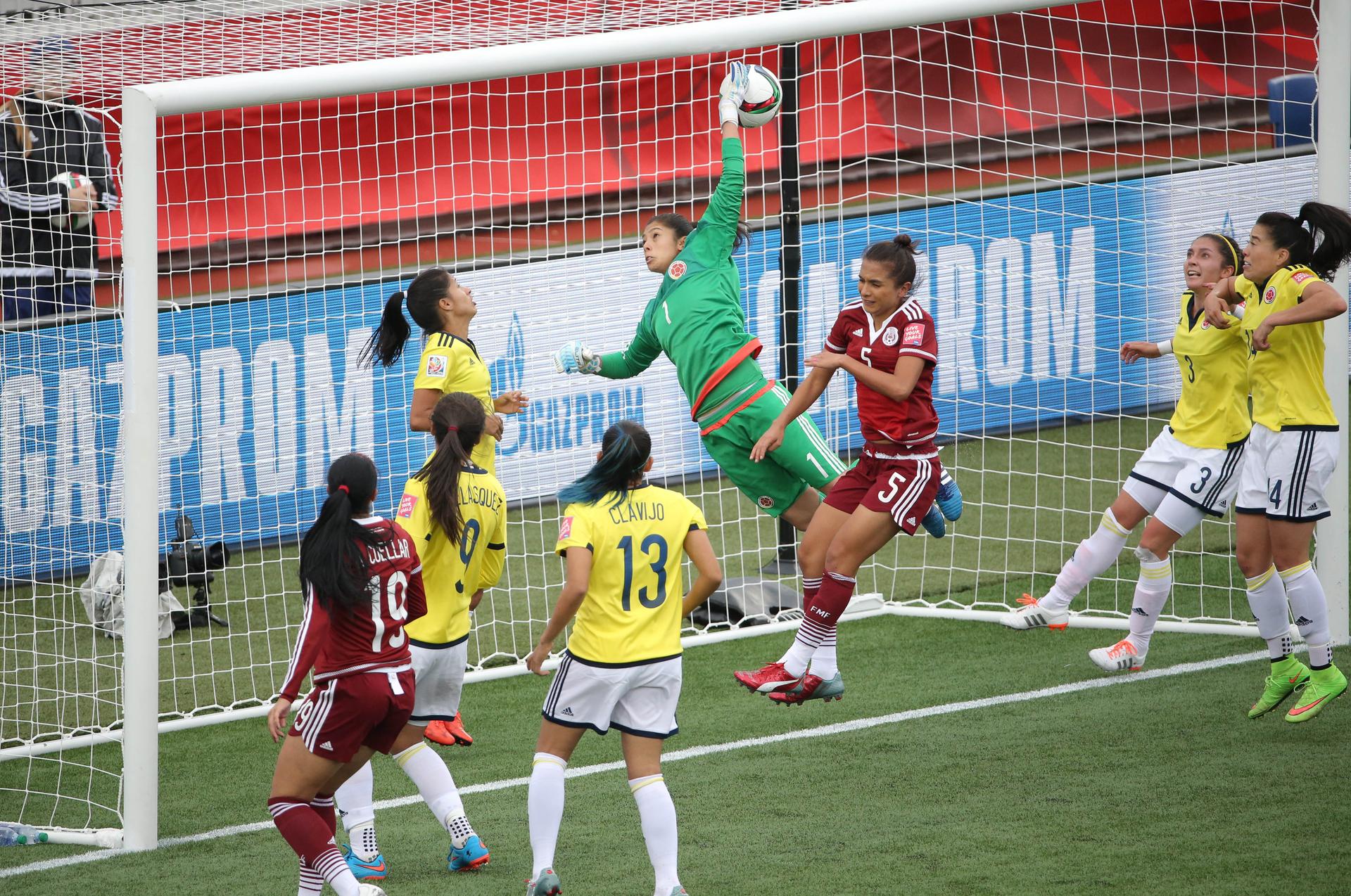 Mexico midfielder Veronica Perez scores a goal past Colombia goalkeeper Stefany Castano (1) during a Group F soccer match in the 2015 FIFA Women's World Cup at Moncton Stadium.