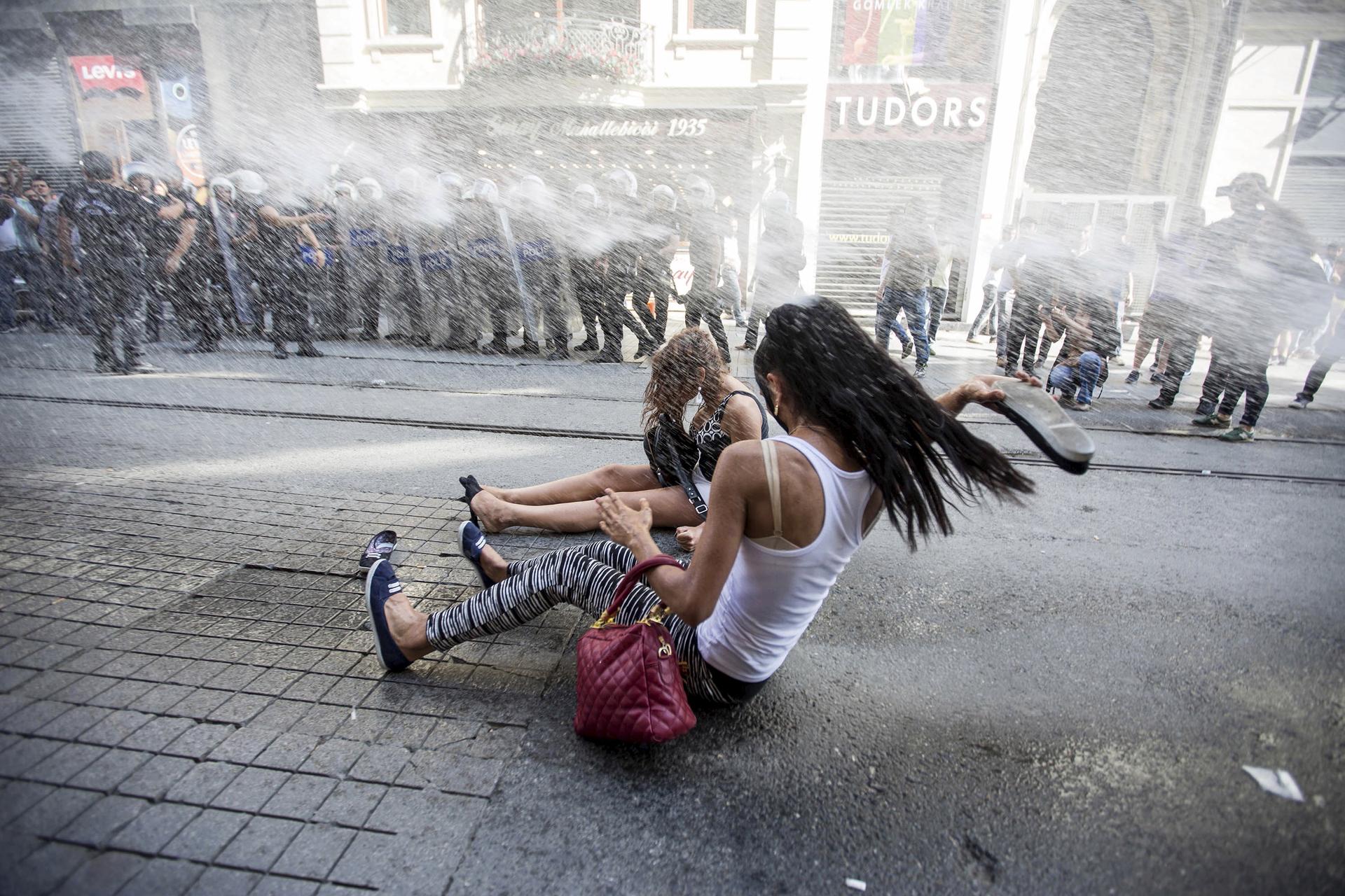 Riot police use a water cannon to disperse LGBT rights activist before a Gay Pride Parade in central Istanbul, Turkey, June 28, 2015.