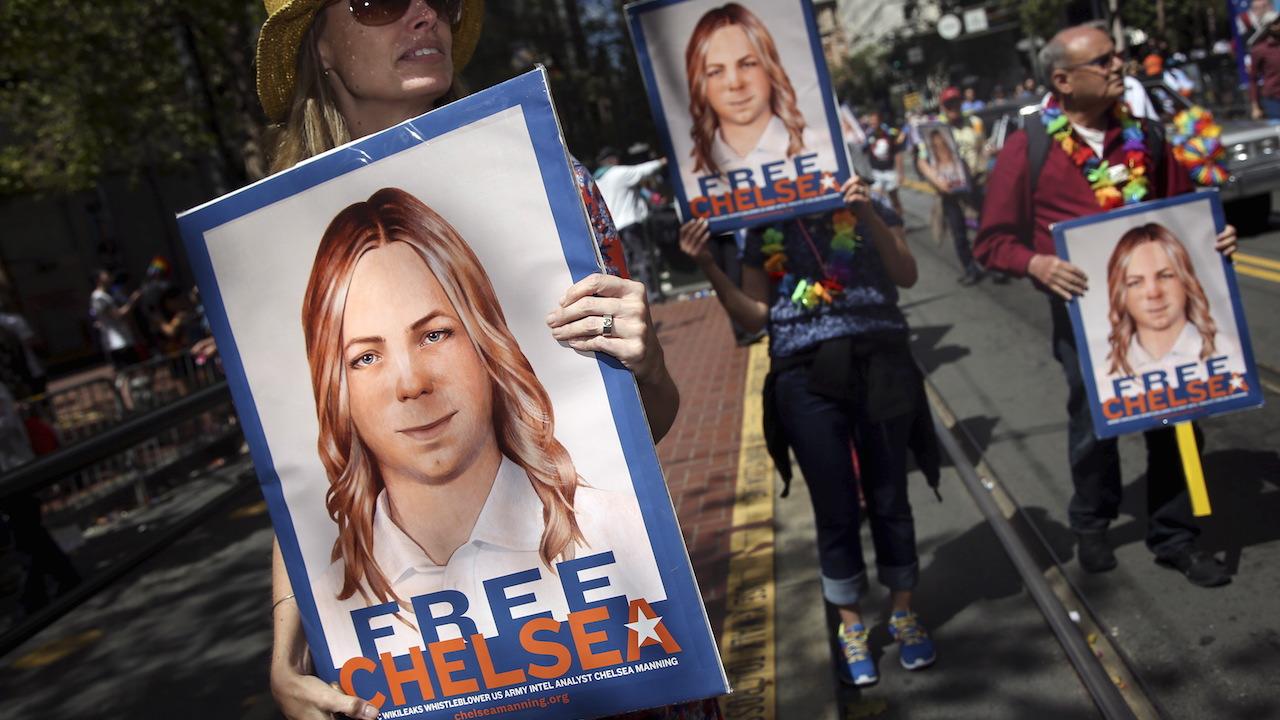 People hold signs calling for the release of imprisoned whistleblower Chelsea Manning in San Francisco, 2015